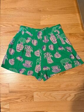 Corey Lynn Calter for Anthropologie green shorts with pink illustration print